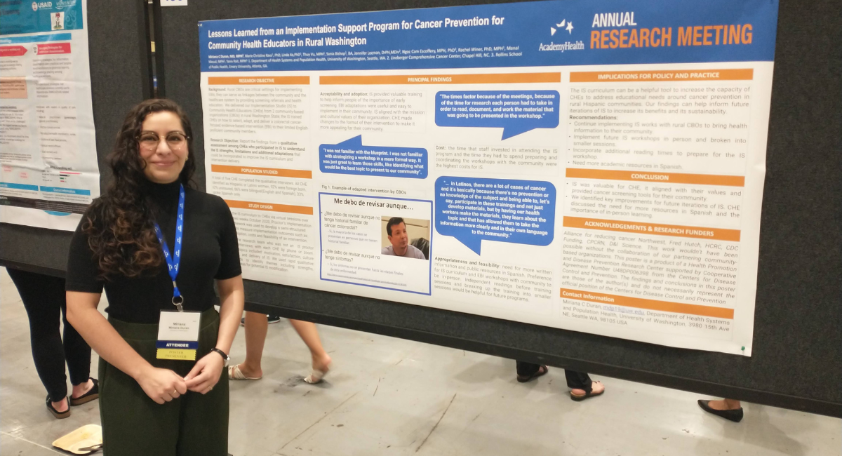 Miriana Duran stands in front of a poster
