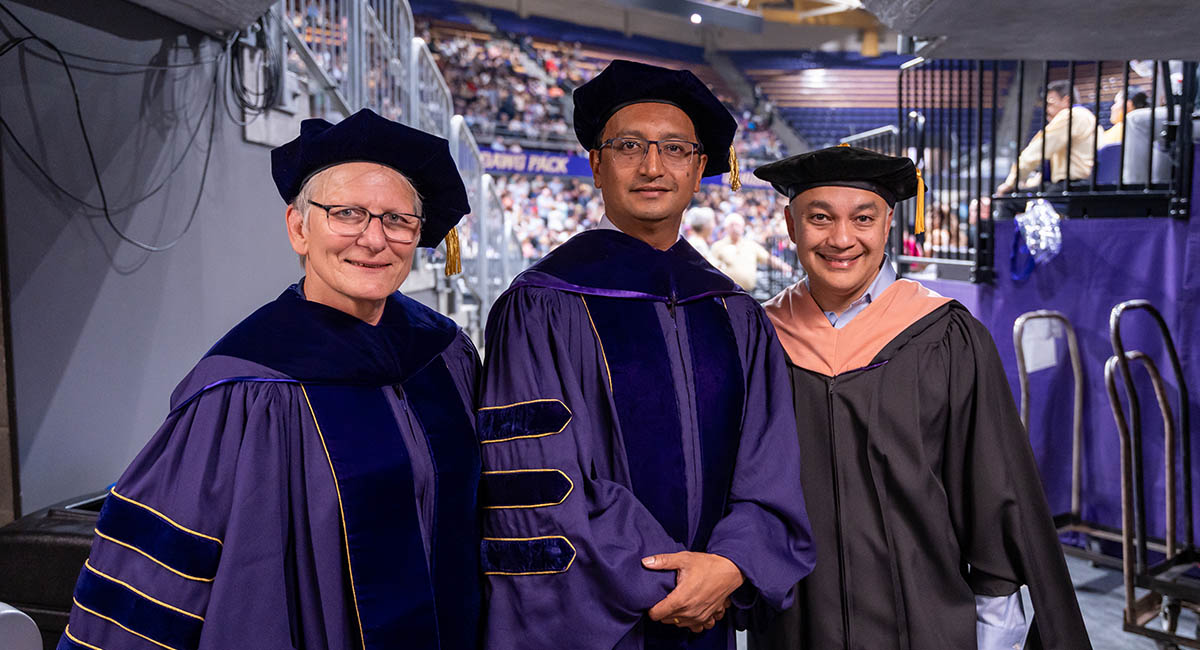 Liz, Biraj and Umair at graduation event